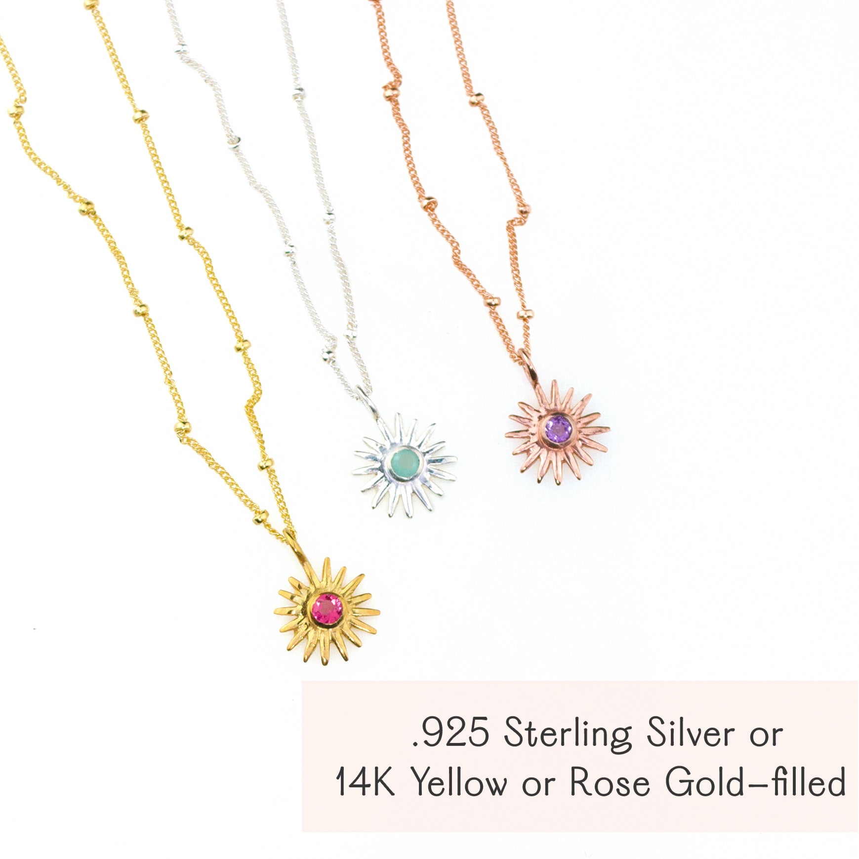 Aesthetic flatlay of sunburst birthstone necklaces arranged on soft fabric, showing multiple gemstone colors and chain styles in gold filled, sterling silver and rose gold filled. Personalized birthstone sun necklace perfect for birthdays, Mother’s Day, Christmas or best friend gifts, available with all twelve birthstones. Dainty everyday jewelry piece ideal for stacking, gifting and minimalist style lovers.