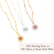Aesthetic flatlay of sunburst birthstone necklaces arranged on soft fabric, showing multiple gemstone colors and chain styles in gold filled, sterling silver and rose gold filled. Personalized birthstone sun necklace perfect for birthdays, Mother’s Day, Christmas or best friend gifts, available with all twelve birthstones. Dainty everyday jewelry piece ideal for stacking, gifting and minimalist style lovers.