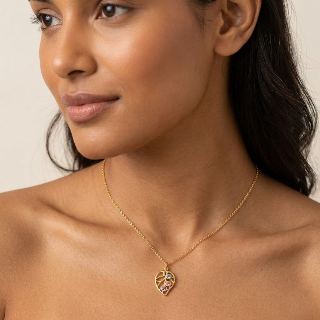 Leaf pendant necklace with up to four birthstones, available in sterling silver, 18K vermeil gold, and rose gold vermeil options.