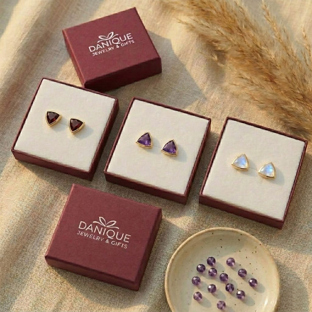Labradorite triangle stud earrings displayed in Danique Jewelry gift boxes, ready for gifting.
