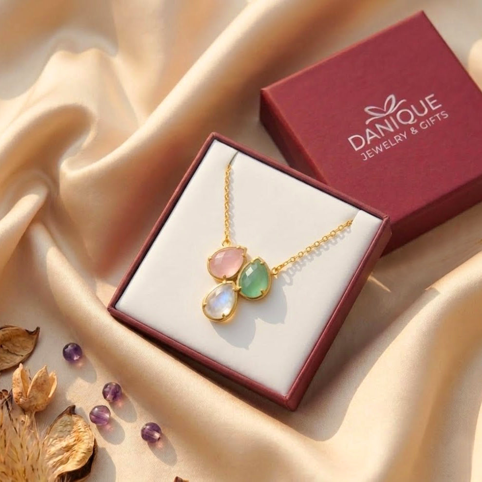 Custom birthstone necklace displayed in a Danique Jewelry gift box with three teardrop stones, ready for Mother’s Day or birthday gifting.
