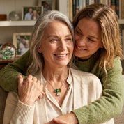 Grandma and granddaughter wearing meaningful birthstone jewelry, custom three birthstone necklace for family keepsake gifting.