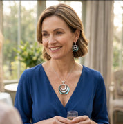 Woman wearing teal triple circle geometric necklace
