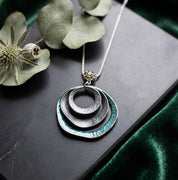 Boho triple circle statement necklace in silver and teal geometric design
