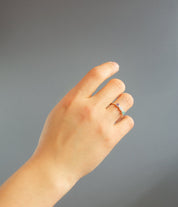 Triple Birthstone Ring for mom on models hand. Great gift for Christmas in Vermeil Gold on a white background. Personalized Birthstone Rings for Mom of three, Perfect gift for Mother's Day. December Birthstone, November Birthstone, and September Birthstone Dainty Bezel Set Ring. January Birthstone, June Birthstone, and February Birthstone Custom Ring with Kids Birthstones. Blue Topaz, Citrine and Kyanite Ring. Garnet, Rainbow Moonstone, and Purple Amethyst Ring
