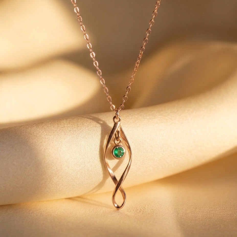 Minimalist mom necklace with birthstones representing children in rose gold