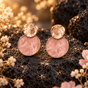 Blush Pink and Rose Gold hammered double disc stud earrings displayed on dark stone

