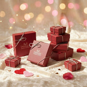 Elegant gift-ready jewelry packaging featuring multiple red Danique Jewelry & Gifts boxes tied with silver ribbon, arranged on a soft neutral background with heart accents and warm bokeh lights. Luxury jewelry gift boxes suitable for Valentine’s Day, anniversaries, birthdays, Mother’s Day, or holiday gifting, conveying premium presentation, thoughtful packaging, and ready-for-gift jewelry across a variety of personalized jewelry listings.