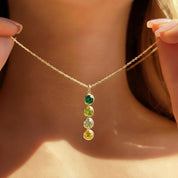 Delicate gold filled birthstone necklace with a single dainty gemstone pendant, worn by a woman for everyday minimalist style. Personalized necklace with birthstone charm, ideal gift for mothers, wives, and daughters. Perfect for birthdays, anniversaries, and Mother’s Day jewelry gifting. Handmade in Massachusetts with attention to detail.