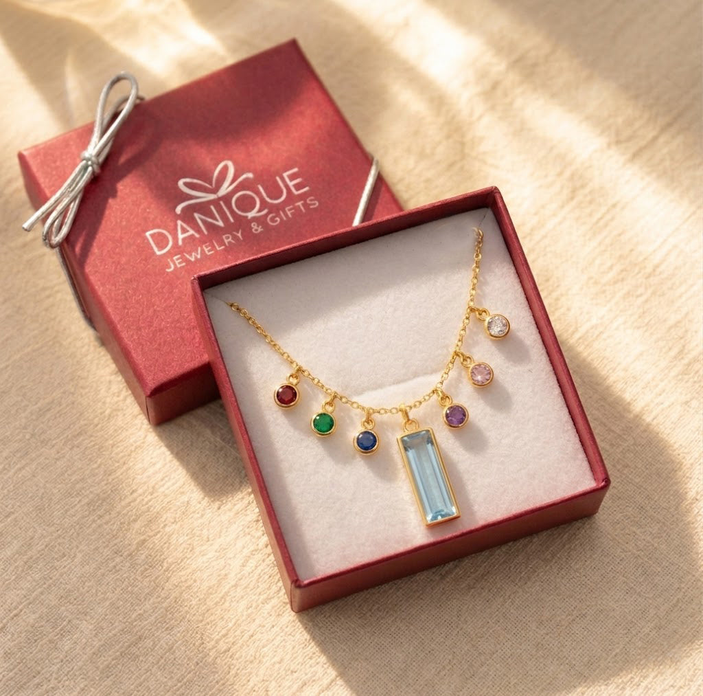 Handmade custom birthstone family necklace with engraved bar charm and tiny gemstone connectors, available with multiple birthstones for kids or grandkids in danique jewelry branded box

