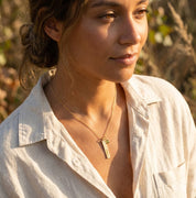 Personalized birthstone bar necklace worn by model in natural light, sentimental jewelry gift for women