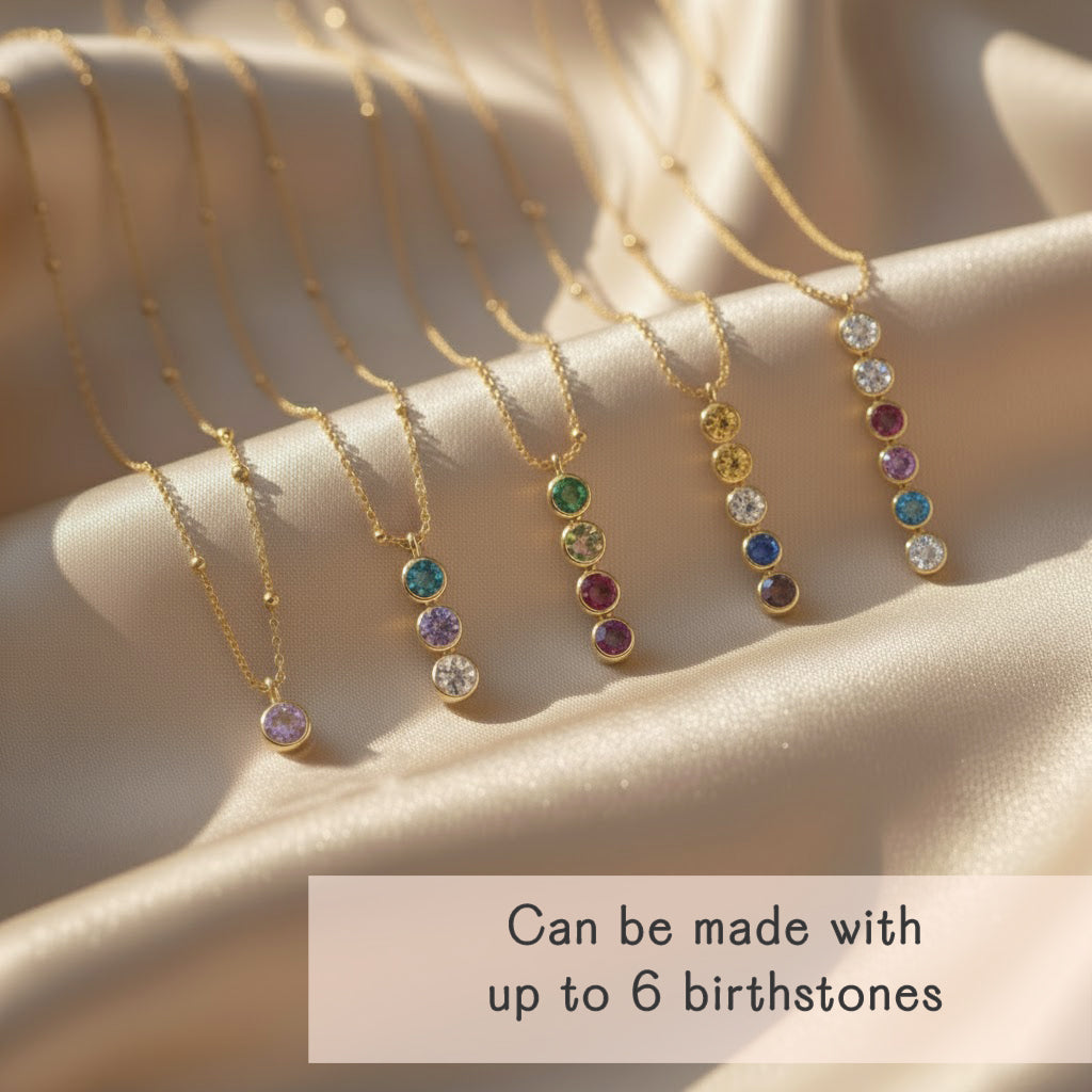 Multiple vertical bar necklaces with colorful birthstones arranged in sets of up to six gemstones. Available in sterling silver, rose gold, and yellow gold filled chains. Minimalist jewelry design perfect as a family birthstone necklace, a meaningful push present, or an anniversary gift. Elegant, handcrafted, and personalized.
