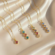 Assorted personalized birthstone bar necklaces showcasing custom gemstone combinations, minimalist family jewelry available with up to six birthstones, thoughtful gift for moms or grandmas.