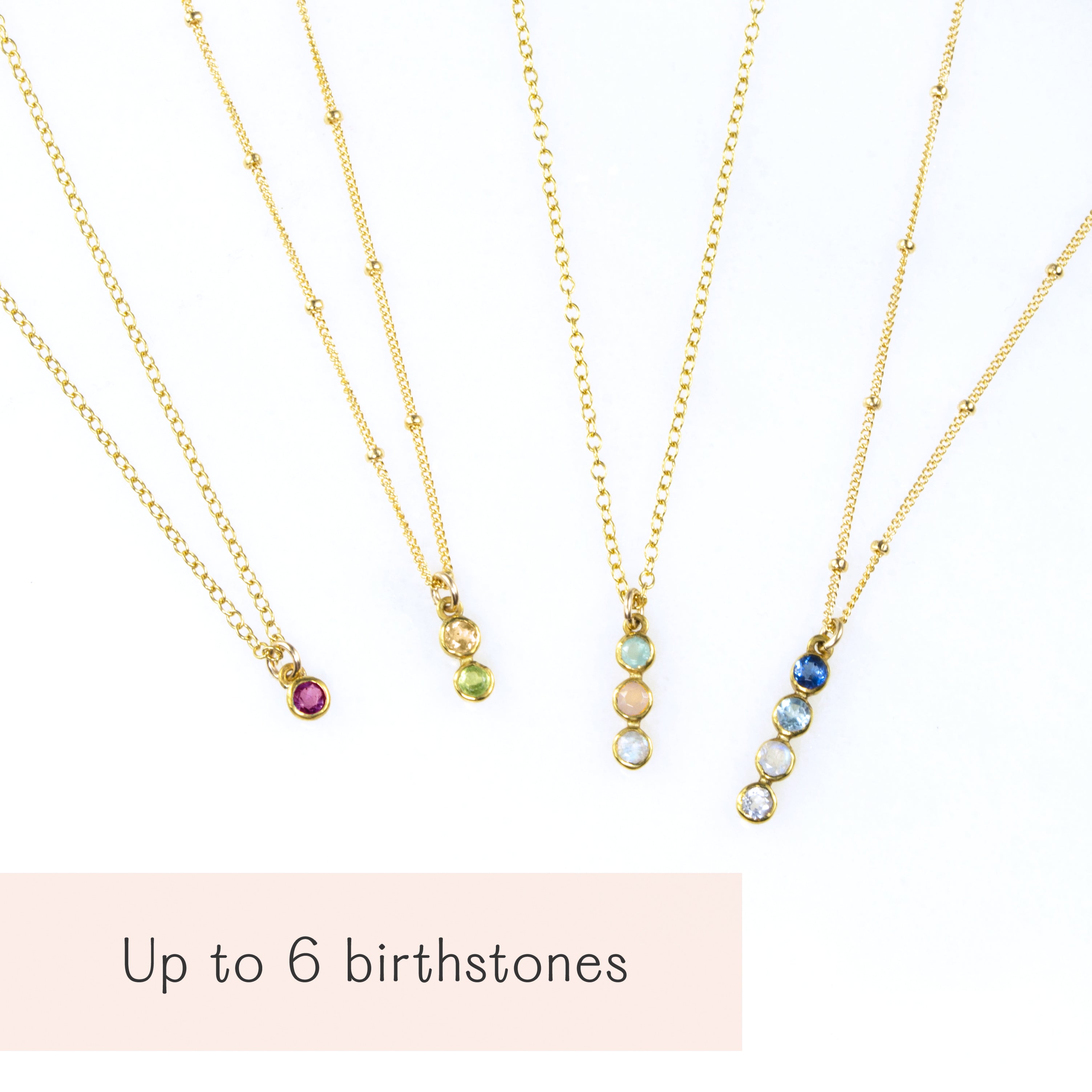 Multiple vertical bar necklaces with colorful birthstones arranged in sets of up to six gemstones. Available in sterling silver, rose gold, and yellow gold filled chains. Minimalist jewelry design perfect as a family birthstone necklace, a meaningful push present, or an anniversary gift. Elegant, handcrafted, and personalized.