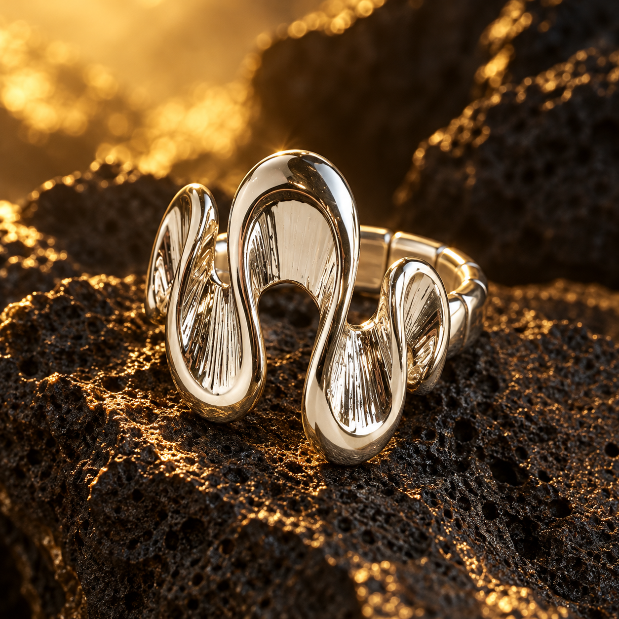 
Silver Shifting Waves sculptural adjustable ring displayed on dark textured stone