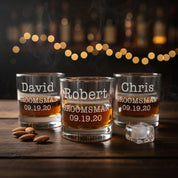 Personalized groomsmen whiskey glasses with engraved names and wedding dates, custom old fashioned rocks glasses for best man and wedding party, unique bourbon lover gift for men.
