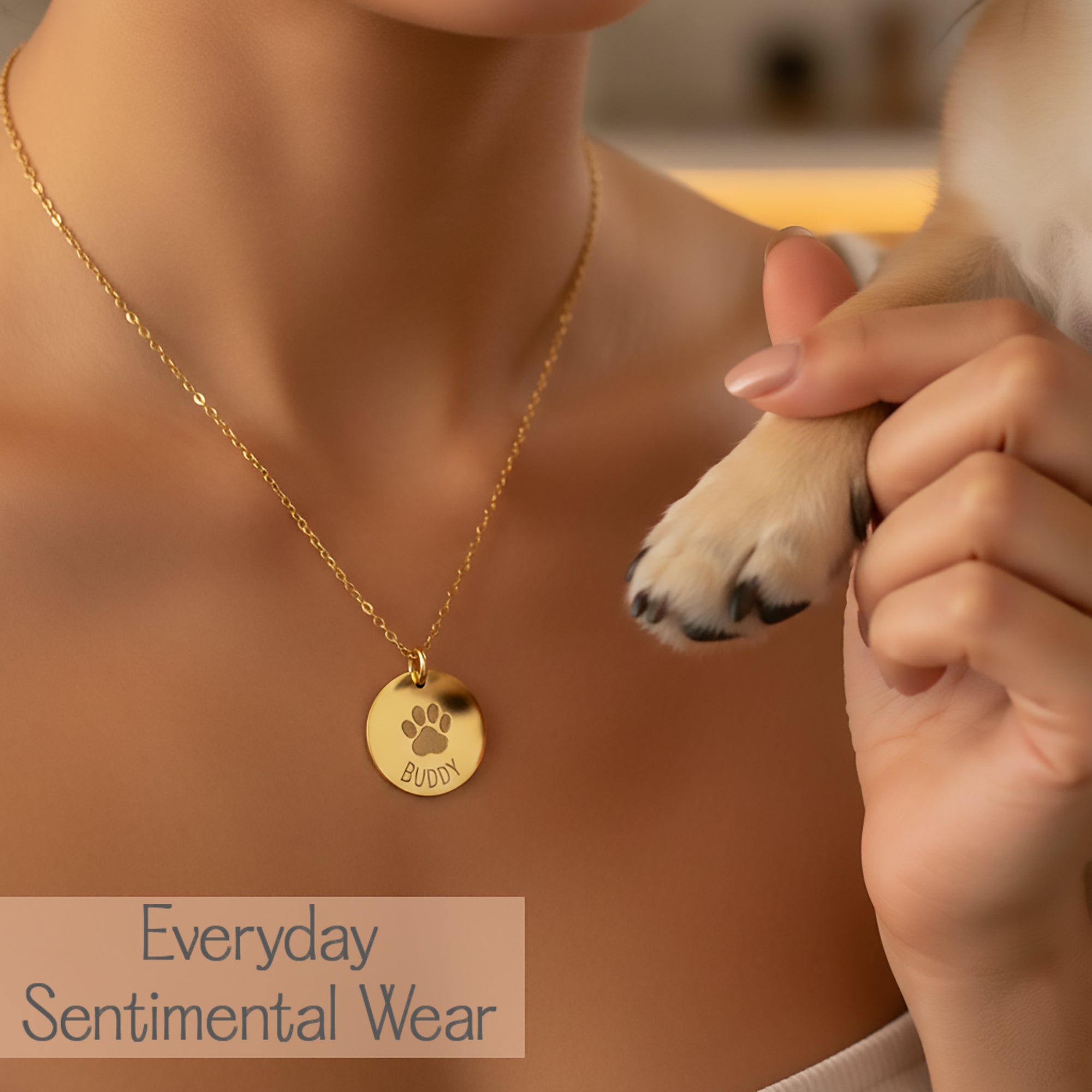 Lifestyle image of paw print necklace worn on neckline, personalized pet necklace designed for everyday sentimental wear, round engraved paw print charm in gold, minimalist jewelry for pet lovers, custom pet memorial necklace honoring a dog or cat, meaningful keepsake jewelry with emotional value, handmade engraved pet necklace on fine chain