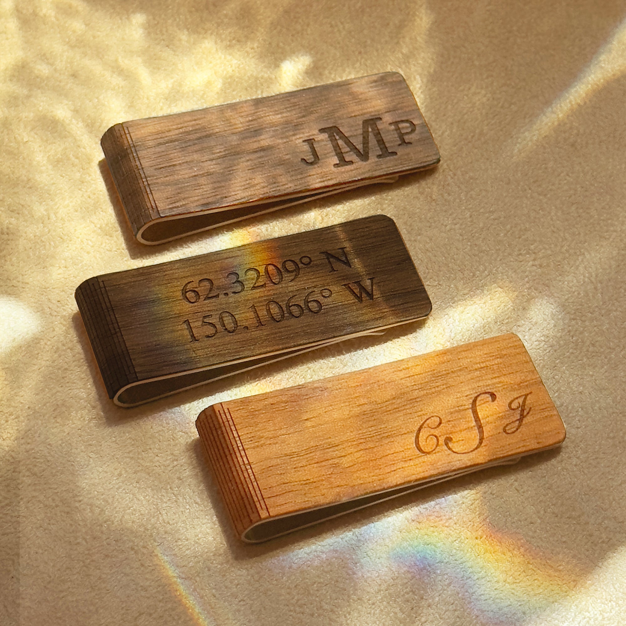 Personalized wood money clips in walnut, cherry, and maple, engraved with monogram, coordinates, and initials. Handcrafted and laser engraved for lasting detail, these custom wood money clips make unique gifts for men, including weddings, Father’s Day, graduations, and anniversaries. Slim design keeps bills secure while adding rustic charm to his everyday carry; perfect for eco-friendly and minimalist lifestyle accessories.