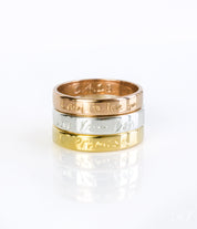 A stack of three rings in gold, silver and rose gold. Custom engraved band, fingerprint ring, 4mm thin jewelry, sterling silver ring, gold personalized band, rose gold accessory, names, dates, and coordinates, photo engraving option, heartfelt keepsake, timeless gift idea, modern design, sizes 4-13, elegant look