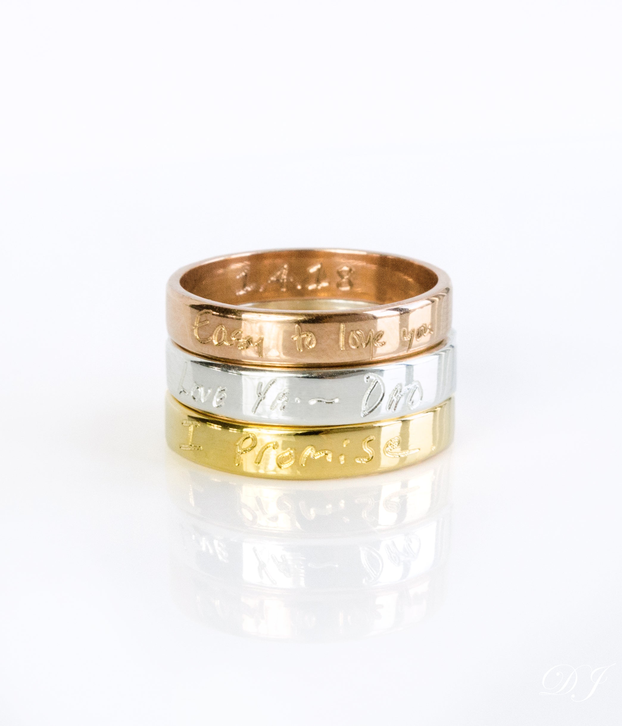 A stack of three rings in gold, silver and rose gold. Custom engraved band, fingerprint ring, 4mm thin jewelry, sterling silver ring, gold personalized band, rose gold accessory, names, dates, and coordinates, photo engraving option, heartfelt keepsake, timeless gift idea, modern design, sizes 4-13, elegant look