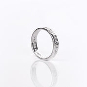 A sterling silver engraved ring on its side. Names are visibly engraved on the sides. Fingerprint engraved ring, custom handwriting band, 4mm sterling silver, gold personalized jewelry, rose gold thin band, special name engraving, date and location, photo engraving, thoughtful gift, meaningful keepsake, inside or outside engraving, US sizes 4-13