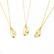 Butterfly pendant wing birthstone necklace in gold plated with satellite chain and purple amethyst 3mm birthstone; center is a gold plated necklace with cable chain featuring peridot and iolite gemstones, third is a gold plated butterfly wing with aqua chalcedony, pink chalcedony and moonstone birthstones. Birthstone necklace, birthstone jewelry, sterling silver, dainty gemstones
