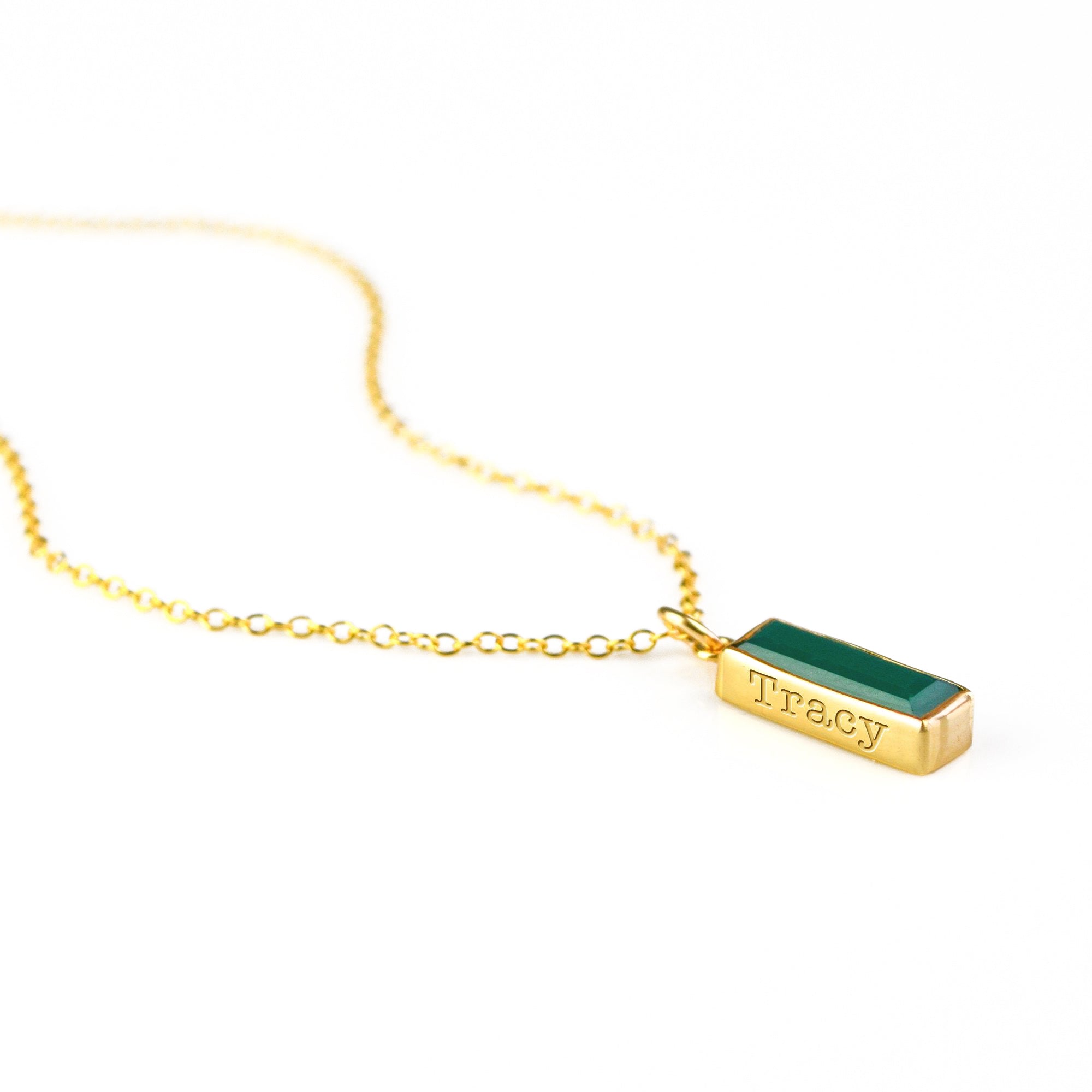 Single gold filled cable chain with green tourmaline gemstone engraved with classic font may birthstone on white background