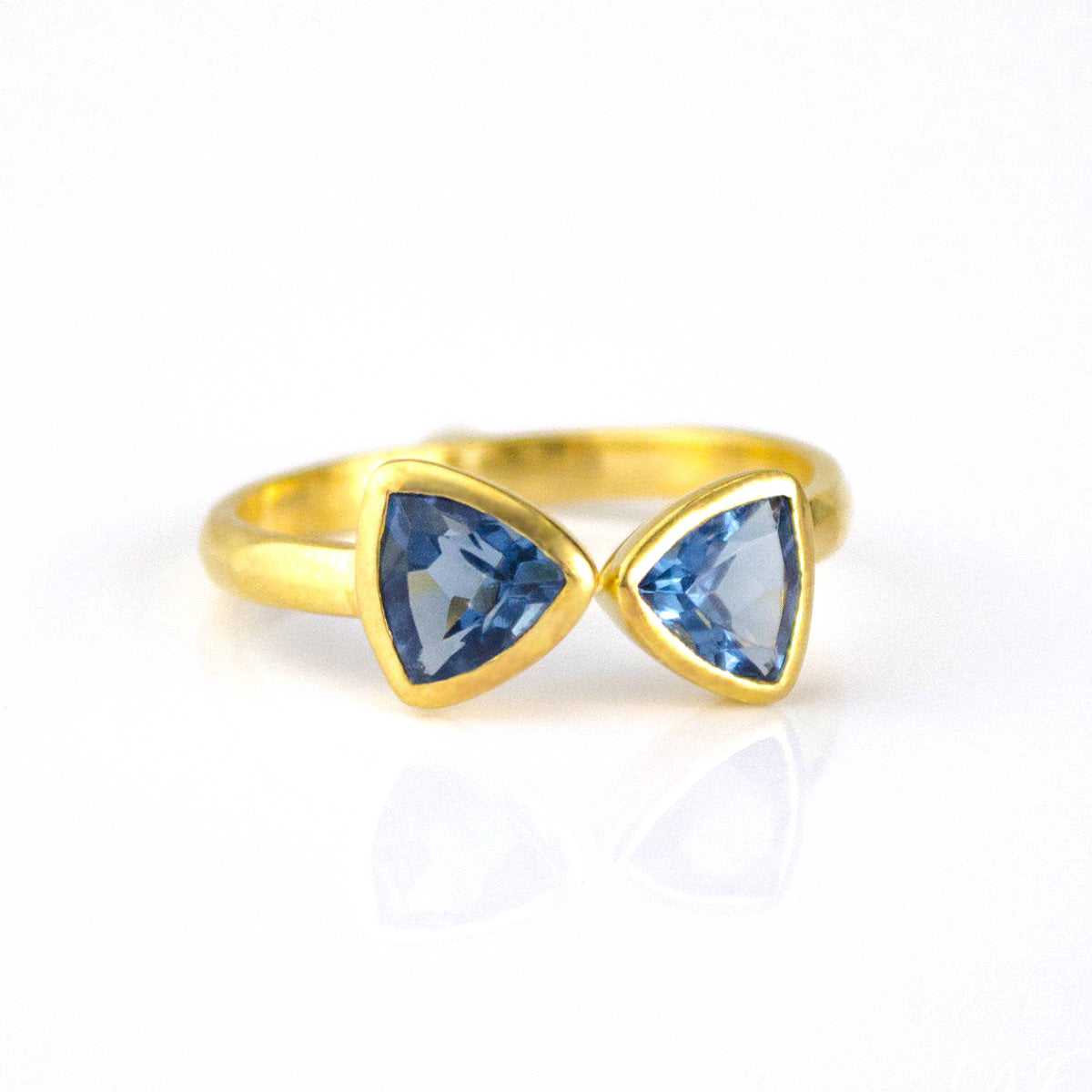 A gold kyanite ring. Kyanite Quartz triangle ring, adjustable Kyanite Quartz ring, double triangle Kyanite, personalized Kyanite jewelry, sterling silver Kyanite ring, gold Kyanite Quartz ring, rose gold Kyanite ring, unique Kyanite gemstone, September birthstone ring, custom triangle-cut Kyanite, bespoke Kyanite Quartz jewelry, chic Kyanite accessory, elegant blue gemstone ring, Kyanite stacking ring, custom gemstone jewelry, trendy triangle ring, adjustable Kyanite band, unique birthstone jewelry