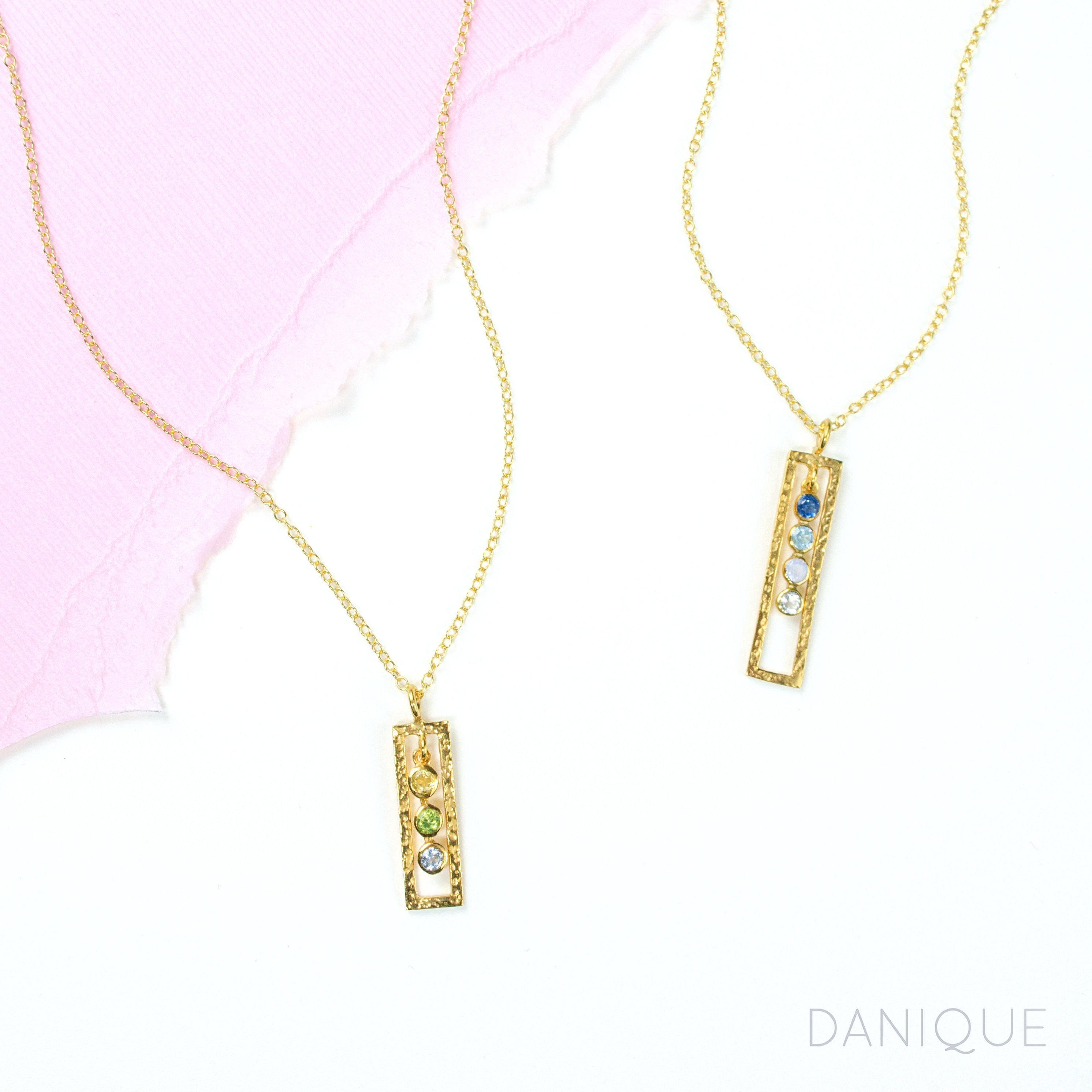 2 gold filled open frame birthstone necklace. First necklace features citrine, peridot and blue topaz birthstones. Second necklace has kyanite, blue topaz, moonstone and clear birthstones. 