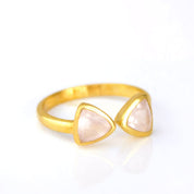 A gold pink chalcedony bow tie ring. Adjustable Pink Chalcedony triangle ring, Pink Chalcedony bow tie ring, personalized Pink Chalcedony jewelry, sterling silver Pink Chalcedony, gold triangle ring, rose gold Pink Chalcedony, unique gemstone ring, Pink Chalcedony birthstone ring, triangle-cut Pink Chalcedony, custom gemstone ring, chic Pink Chalcedony accessory, bespoke gemstone jewelry, Pink Chalcedony stacking ring, elegant triangle ring, trendy Pink Chalcedony ring, custom gemstone gift, adjustable ring