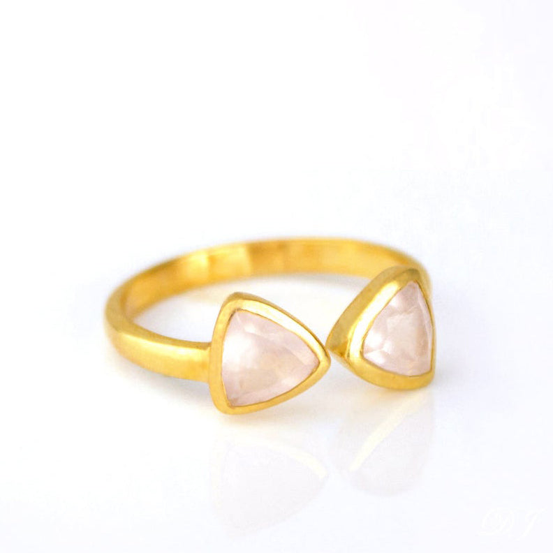 A gold pink chalcedony bow tie ring. Adjustable Pink Chalcedony triangle ring, Pink Chalcedony bow tie ring, personalized Pink Chalcedony jewelry, sterling silver Pink Chalcedony, gold triangle ring, rose gold Pink Chalcedony, unique gemstone ring, Pink Chalcedony birthstone ring, triangle-cut Pink Chalcedony, custom gemstone ring, chic Pink Chalcedony accessory, bespoke gemstone jewelry, Pink Chalcedony stacking ring, elegant triangle ring, trendy Pink Chalcedony ring, custom gemstone gift, adjustable ring