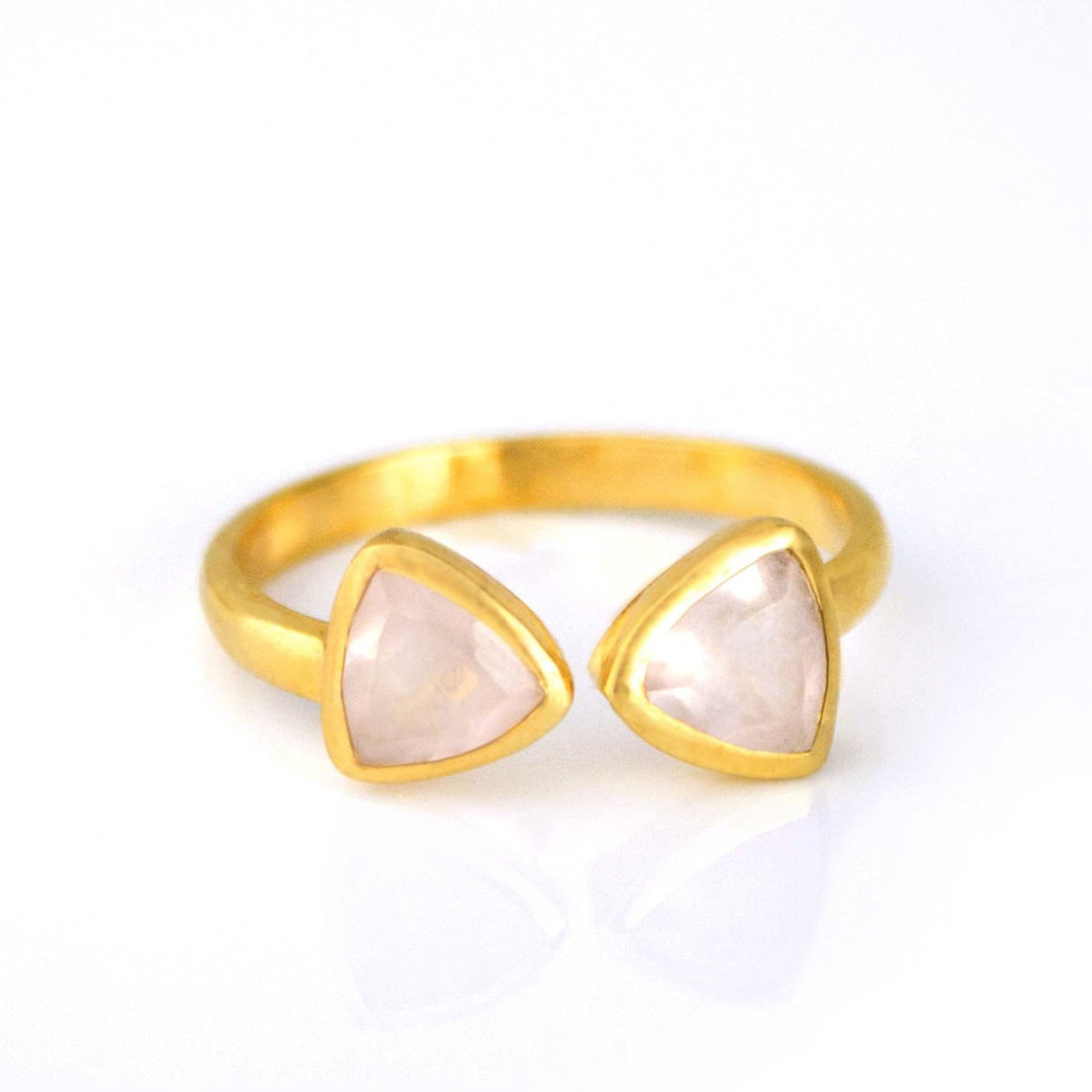 A gold set pink chalcedony double triangle ring. Pink Chalcedony triangle ring, adjustable Pink Chalcedony ring, double triangle gemstone, personalized Pink Chalcedony jewelry, sterling silver Pink Chalcedony ring, gold Pink Chalcedony ring, rose gold Pink Chalcedony, unique Pink Chalcedony ring, custom triangle-cut gemstone, Pink Chalcedony birthstone, bespoke Pink Chalcedony ring, elegant gemstone jewelry, pink gemstone ring, chic triangle ring, Pink Chalcedony stacking ring, custom gemstone jewelry