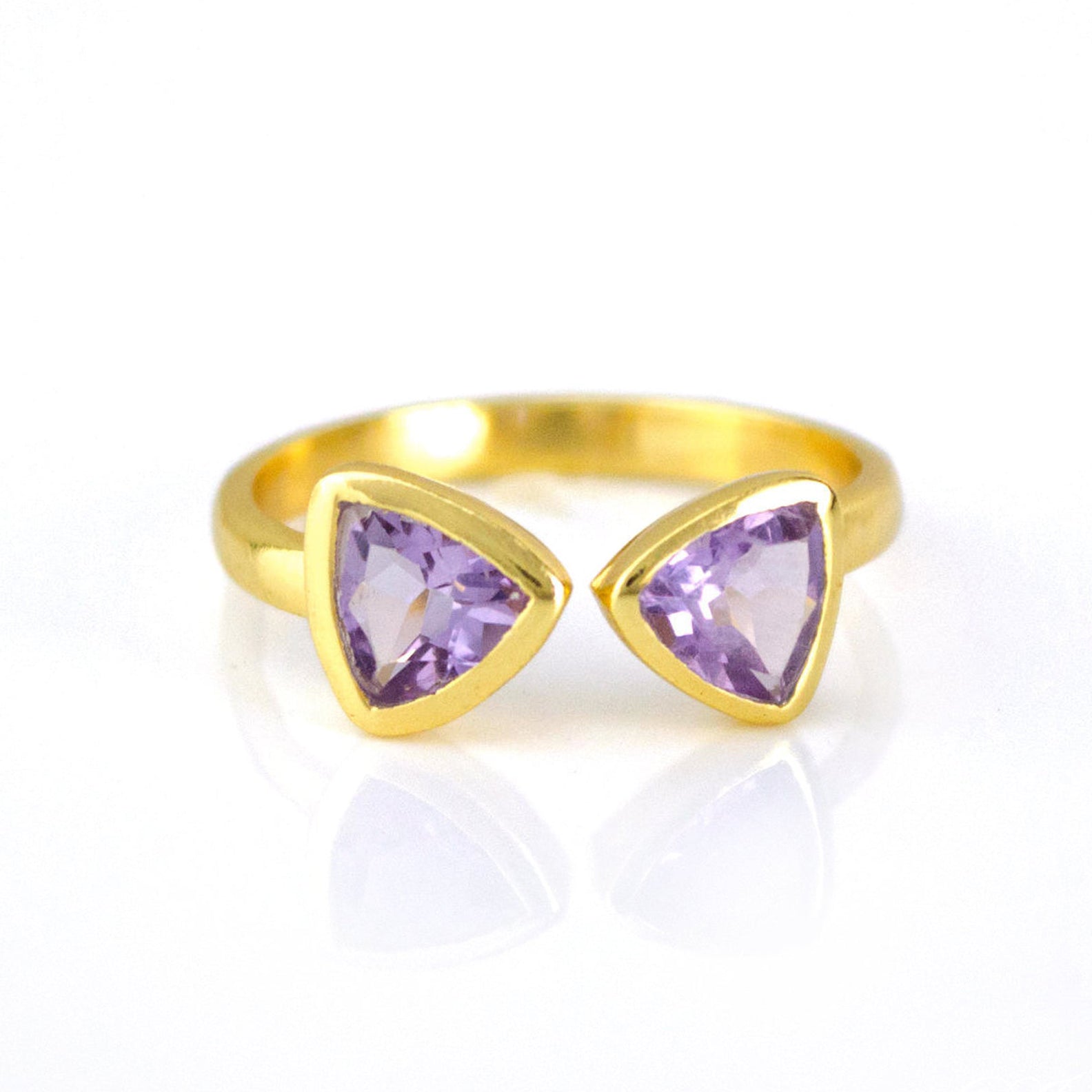 A gold purple amethyst bow tie ring. Adjustable Amethyst ring, Amethyst bow tie ring, double triangle Amethyst, personalized Amethyst jewelry, sterling silver Amethyst ring, gold Amethyst ring, rose gold Amethyst ring, unique Amethyst gemstone, triangle-cut Amethyst, Amethyst birthstone ring, custom Amethyst ring, bespoke Amethyst jewelry, adjustable gemstone ring, elegant Amethyst gift, trendy bow tie ring, Amethyst stacking ring, purple gemstone ring, custom birthstone jewelry, chic Amethyst accessory