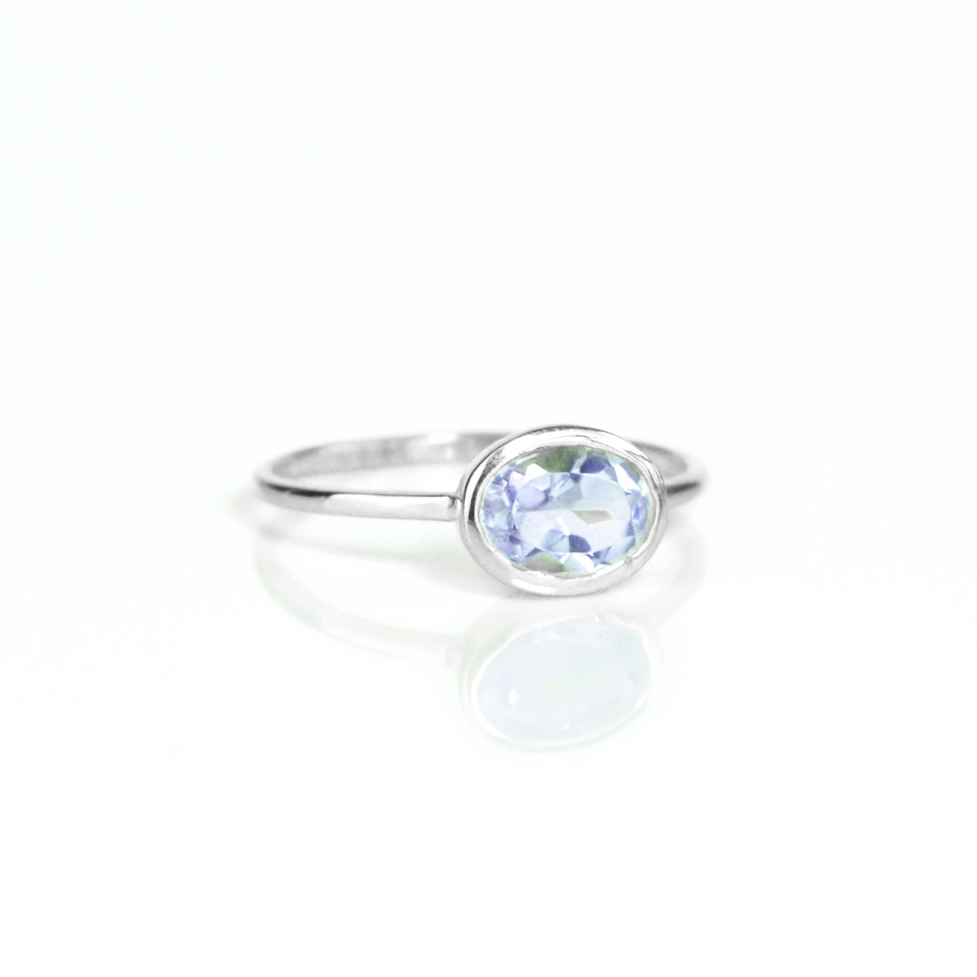 a sterling silver alexandrite ring shown on white background. stackable! Stacking rings, bezel set, small oval, tiny oval, dainty oval, birthstone rings, sterling silver stamp, birthstone ring, birthstone jewelry, purple gemstone, purple birthstone, june birthstone, june gemstone, stack set, stacking rings, gemstone ring, birthstone ring, mother's day gift for her, gift for mom, gift for fiance, gift for girlfriend, wedding jewelry, bridesmaid jewelry, anniversary jewelry, anniversary gift, birthday gift,