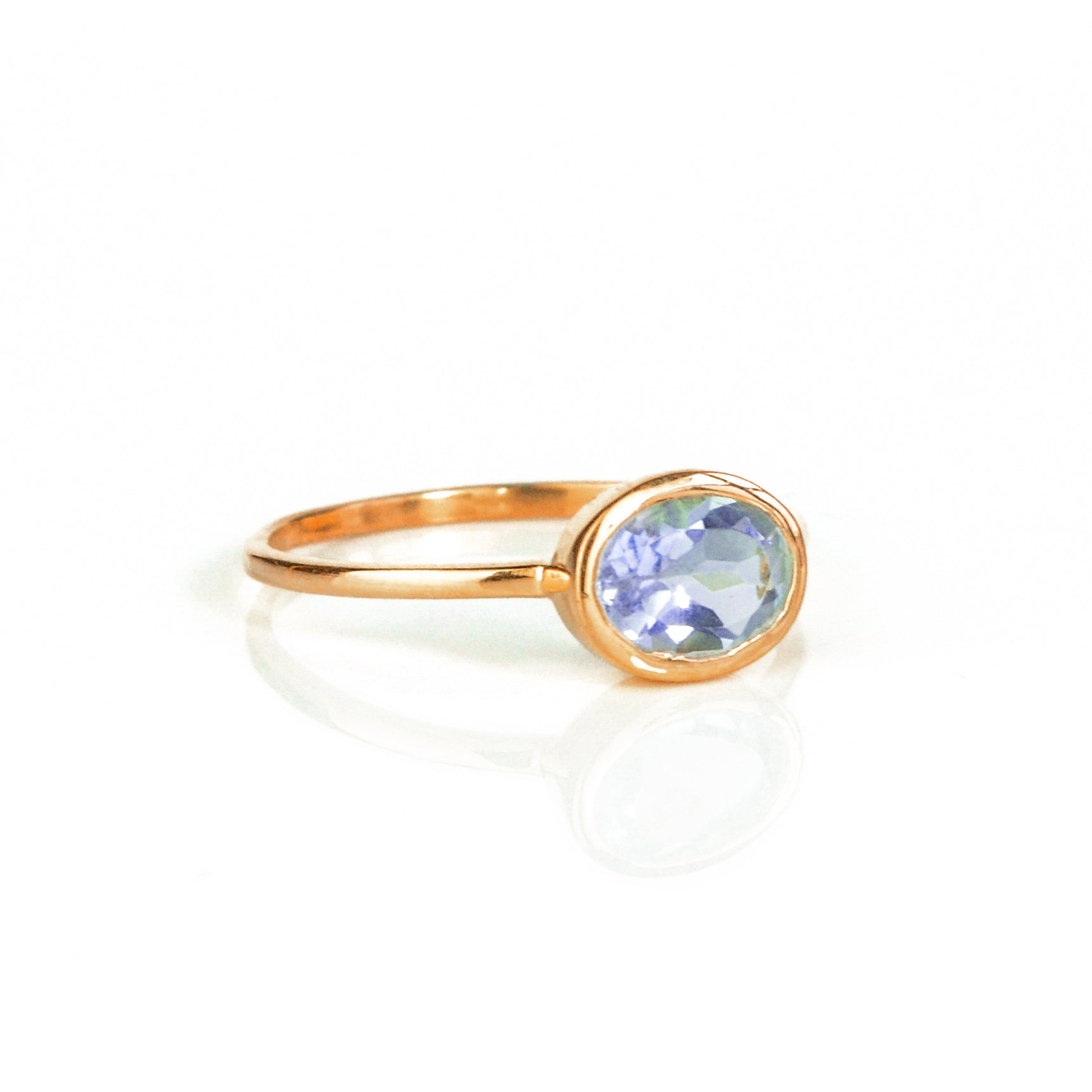 a rose gold alexandrite ring shown on white background. stackable! Stacking rings, bezel set, small oval, tiny oval, dainty oval, birthstone rings, sterling silver stamp, birthstone ring, birthstone jewelry, purple gemstone, purple birthstone, june birthstone, june gemstone, stack set, stacking rings, christmas gift ring, birthstone ring, mother's day gift for her, gift for mom, gift for fiance, gift for girlfriend, wedding jewelry, bridesmaid jewelry, anniversary jewelry, anniversary gift, birthday gift