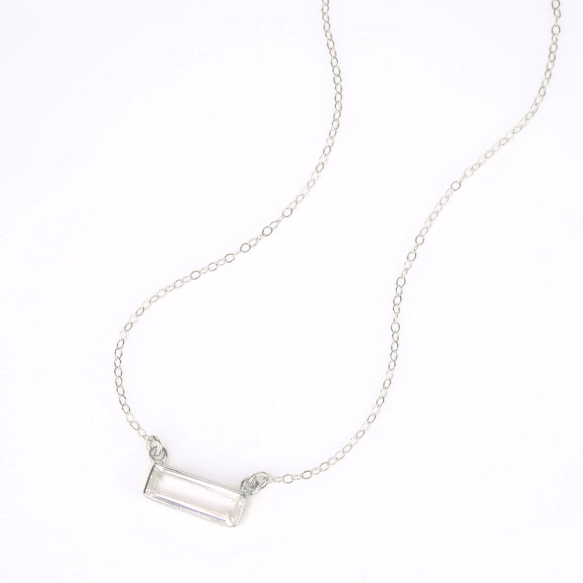 Single sterling silver clear quartz horizontal adira bar necklace. April birthstone birth month.