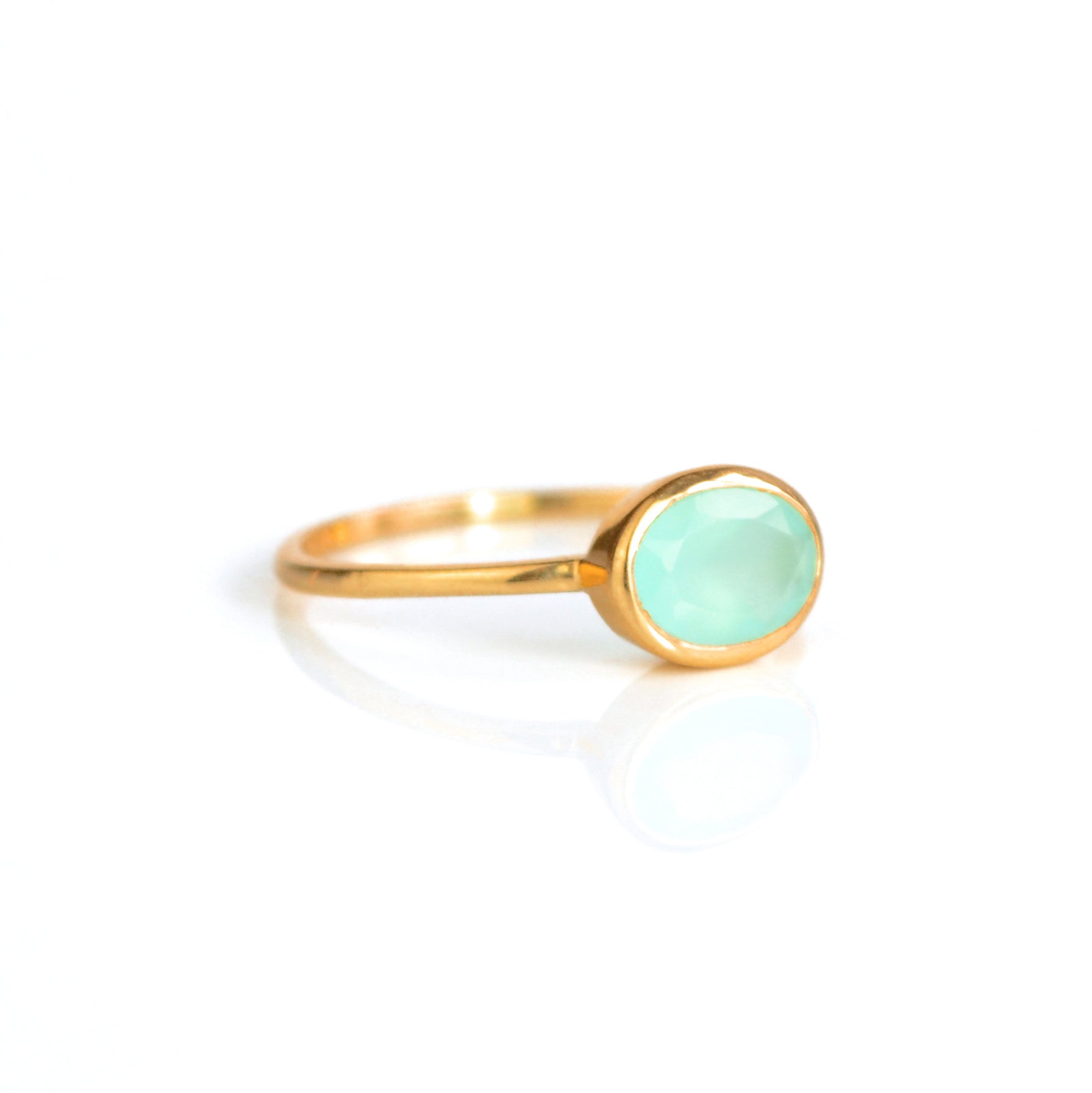a rose gold aqua chalcedony ring shown on white background. Stacking rings, bezel set, small oval, tiny oval, dainty oval, birthstone rings, sterling silver stamp, birthstone ring, birthstone jewelry, march birthstone, march gemstone, stack set, stacking rings, gemstone ring, birthstone ring, mother's day gift for her, gift for mom, gift for fiance, gift for girlfriend, wedding jewelry, bridesmaid jewelry, anniversary jewelry, anniversary gift, birthday gift, christmas gift, valentine's day gift