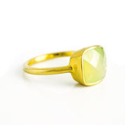 Peridot chalcedony gold plated cushion bezel square stacking ring on white background. August birthday, august gemstone square gemstone, green birthstone, sterling silver ring