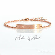 Single rose gold filled bar bracelet featuring handwriting engraved phrase from a photo that says lots of love. 