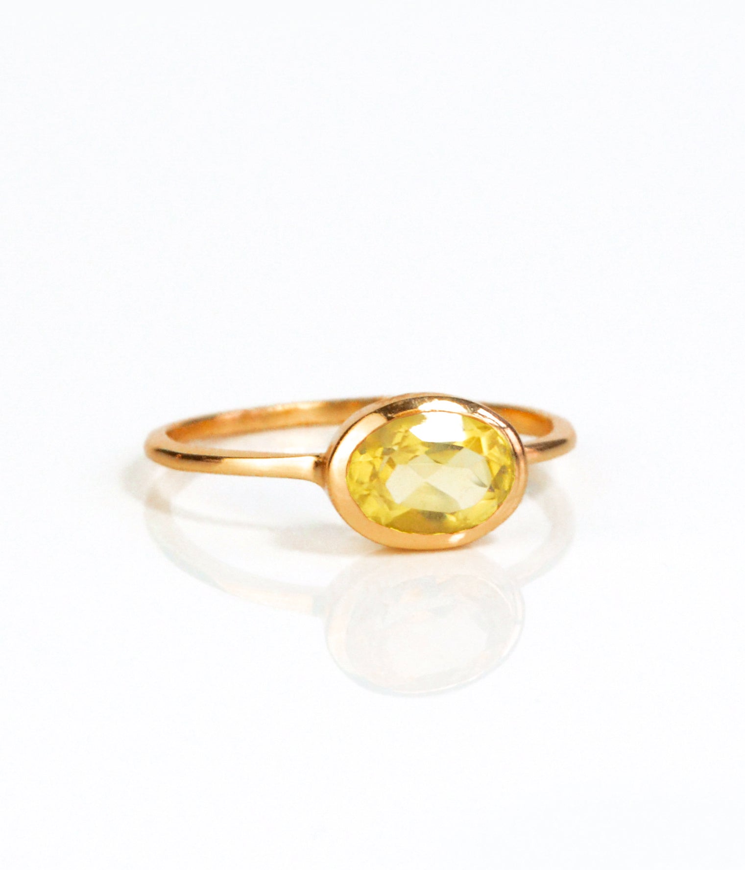 Rose gold plated small oval citrine birthstone ring november birthstone ring on white background