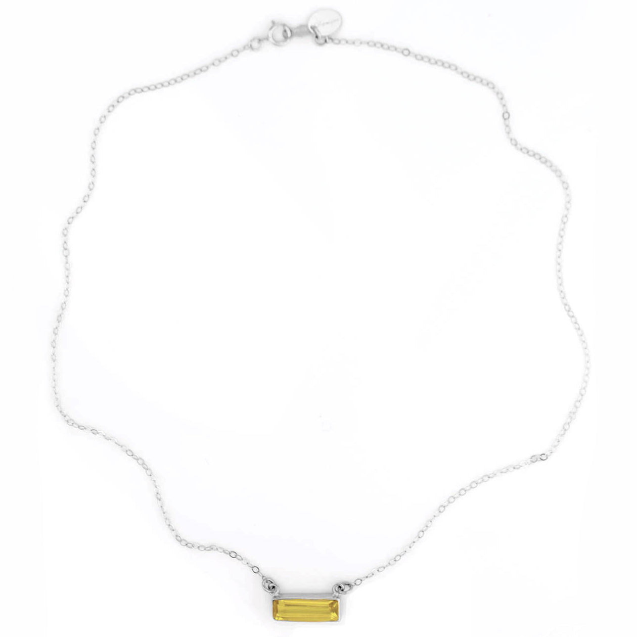 Single sterling silver cable chain horizontal citrine november birthstone bar necklace on white background. 