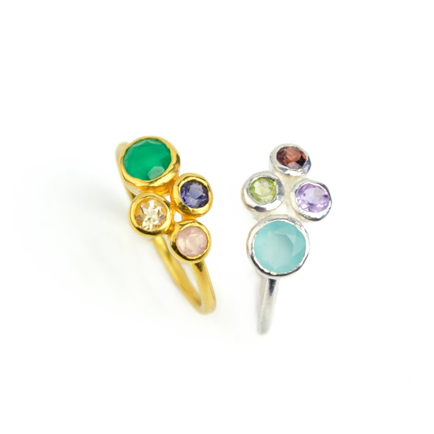 Single gold plated custom mother of three birthstone ring. Mom stone is green onyx, kid's stones are pink chalcedony, kyanite and citrine. Center is a sterling silver ring with aqua chalcedony, purple amethyst, garnet and peridot. 