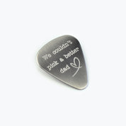 Guitar pick engraved with a special message to dad and a on white background. Father's day gift, birthday gift. 