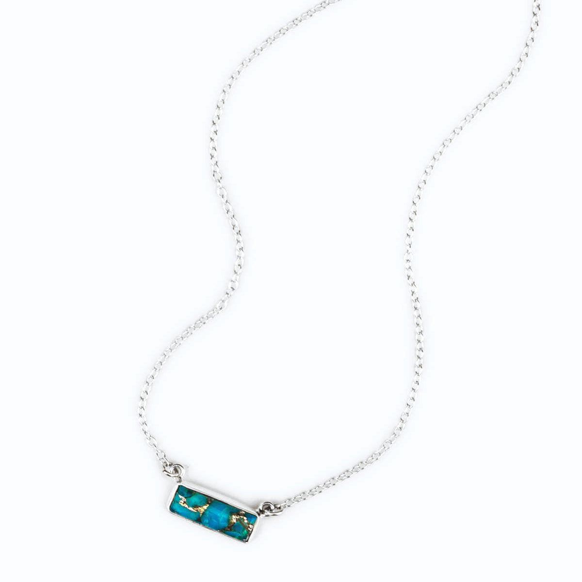 Single sterling silver cable chain copper turquoise horizontal adira bar necklace with white background. december birthstone