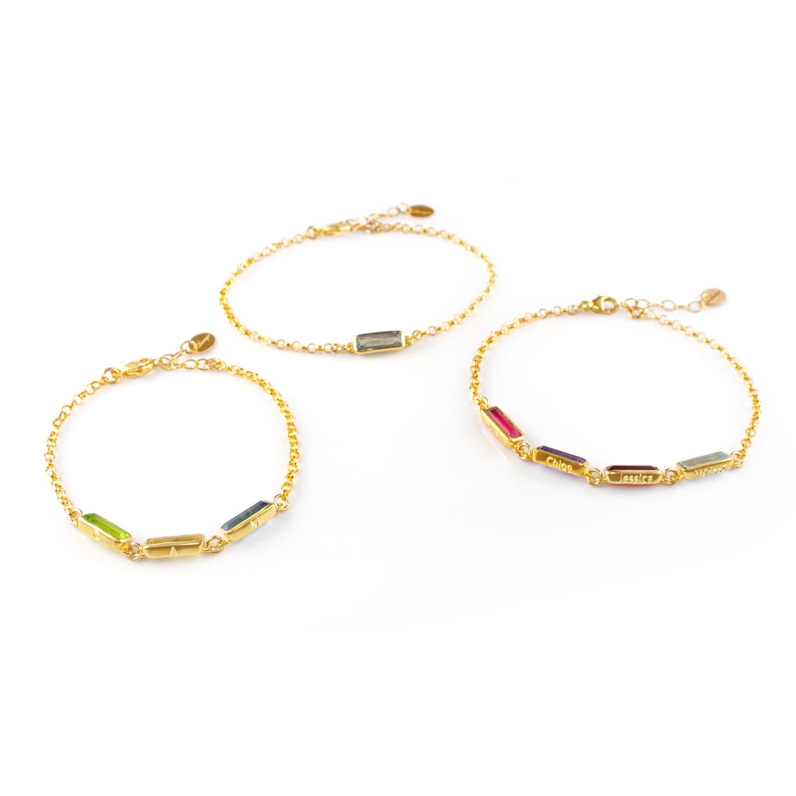 Three gold filled tiny adira bar bracelets with bottom engravings shown on white background. 