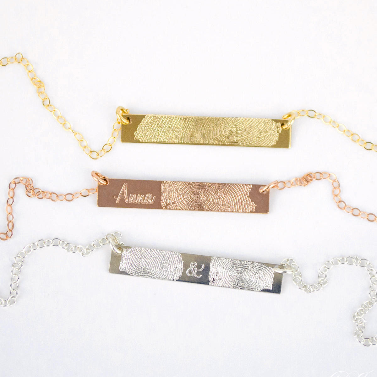 3 engraved fingerprint necklaces against a white background. Personalized minimalist bar necklace Custom engraved bar pendant Minimalist nameplate necklace Custom name bar necklace Engraved horizontal bar necklace Personalized name bar pendant Minimalist engraved necklace Customizable bar pendant jewelry Engraved bar necklace for women Custom coordinates bar necklace Minimalist bar pendant with engraving Personalized message bar necklace 