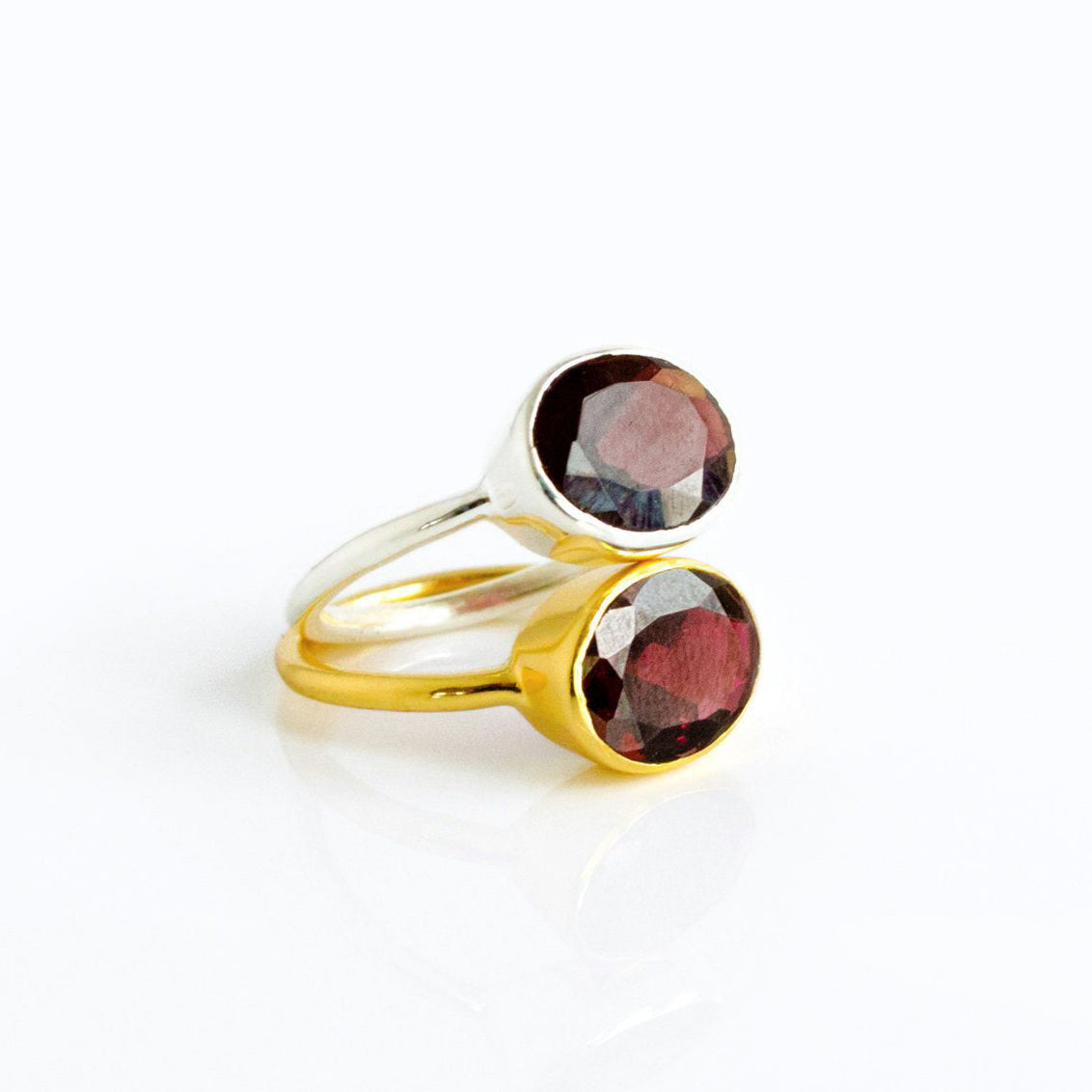 Garnet oval bezel rings in mixed metal finishes—gold vermeil and sterling silver —showing stackable styling; rich red birthstone solitaire rings for January; minimalist, modern oval gemstones; perfect for ring stacks, bridesmaid sets, or mother-daughter gifts; available in sizes 5–10; handcrafted gemstone jewelry.