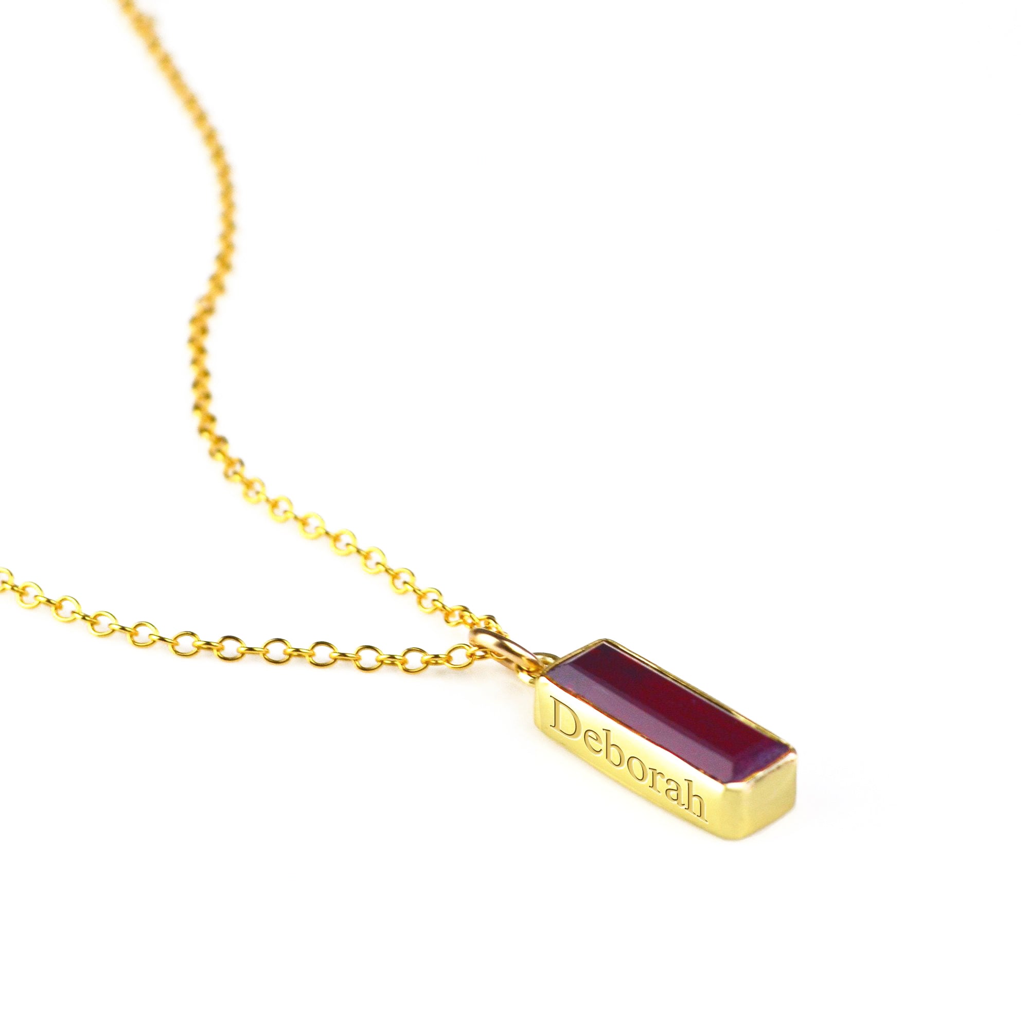Single gold filled cable chain vertical garnet quartz january birthstone adira bar necklace with secret message engraved on white background