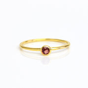 Single gold plated dainty 3mm garnet gemstone ring. January birthstone. On white background. 925 sterling silver, birthstone ring, stacking ring, stackable, birthstone jewelry, facet gemstone