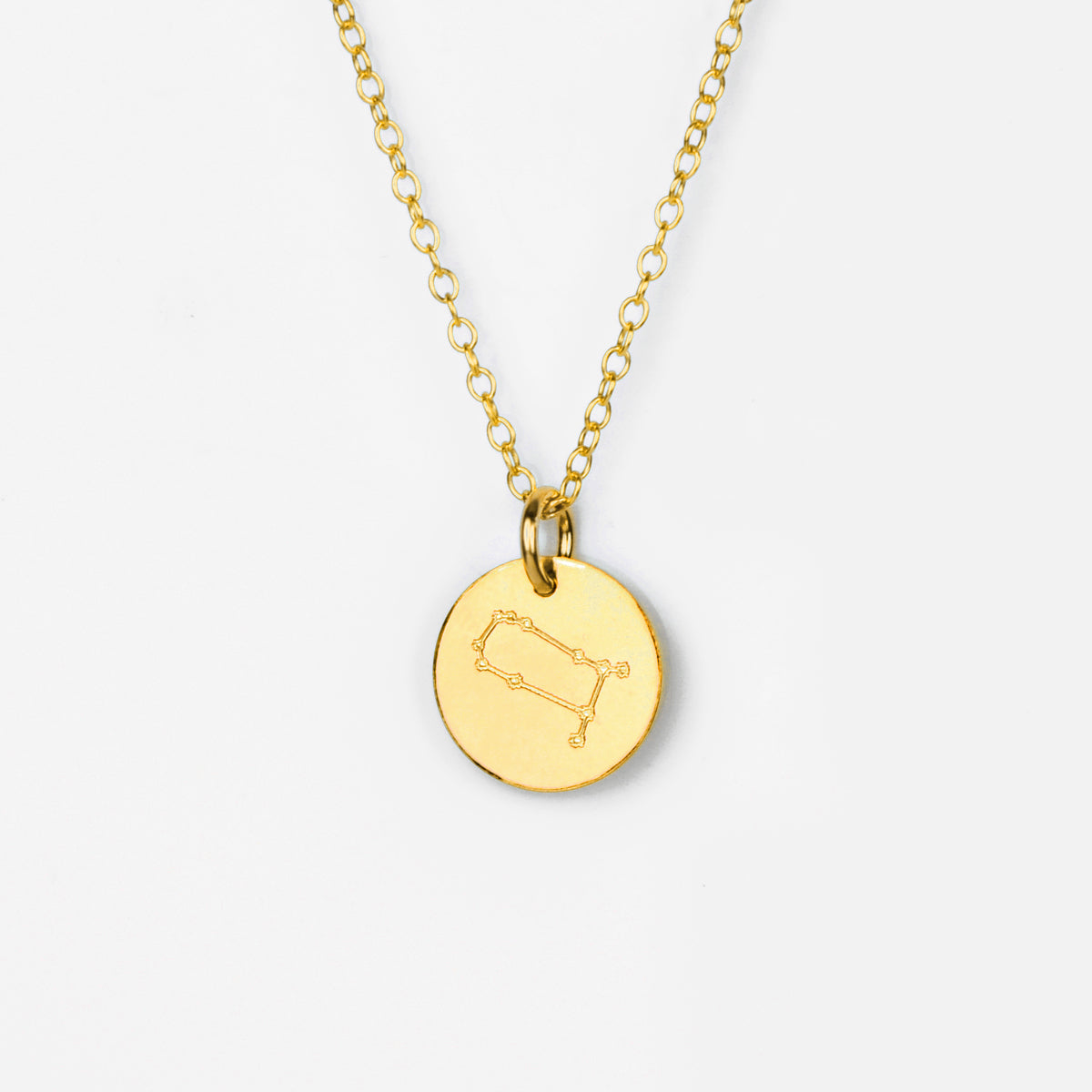 Single gold filled gemini constellation zodiac disc charm shown